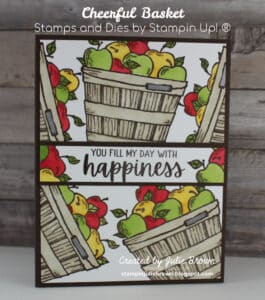 Simple stamping card with Crumb Cake baskets stamped several times some full on and some off the page full of Green , Yellow and Red apples with a sentiment strip saying "You fill my day with Happiness" across the middle backed with an Early Espresso strip of card stock